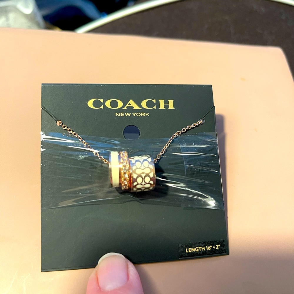NWT RETAILS $128 Coach rose gold necklace
